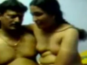 A mature Indian aunty's desires are ignited by a young man's stiff cock. She eagerly indulges in passionate acts.