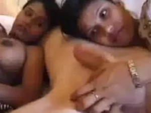 Two Indian babes tease and please each other, culminating in a messy finish.
