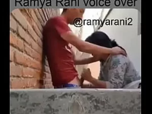 Ramya Rani's deepthroat skills are showcased in a Tamil-language video featuring an older woman and a young man in a school setting.