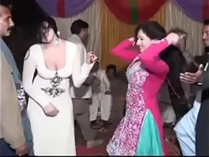 Sultry Pakistani aunty dances and gets intimate with groom, followed by passionate group sex.
